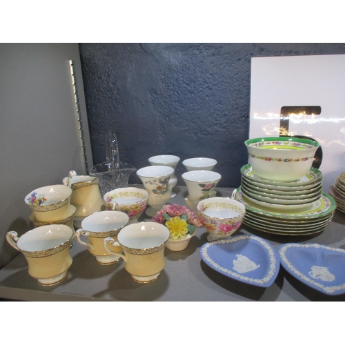 64 - A mixed lot to include Wedgwood blue jasperware, Royal Albert Serana tea cups, character jugs and ot... 