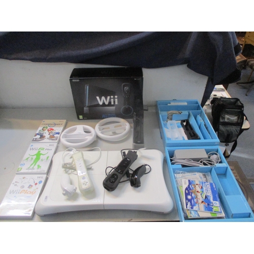 65 - A Nintendo Wii, together with a balance board, games and accessories Location:LWB/FSL