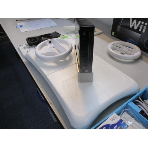 65 - A Nintendo Wii, together with a balance board, games and accessories Location:LWB/FSL