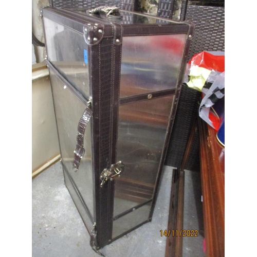 68 - A metal and leather bound travelling trunk with wood lining and leather carrying handles and straps ... 