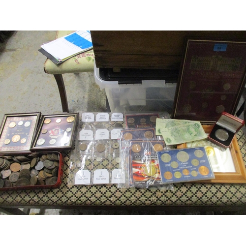 80 - A quantity of British coinage to include framed and glazed sets including a Royal Buckingham collect... 