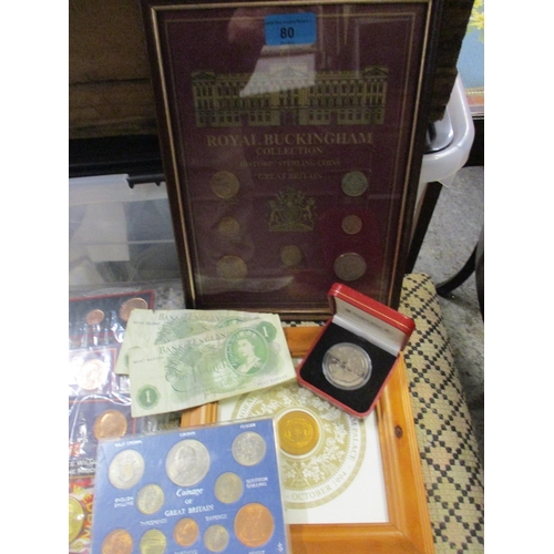 80 - A quantity of British coinage to include framed and glazed sets including a Royal Buckingham collect... 