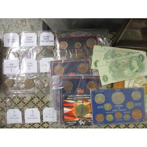 80 - A quantity of British coinage to include framed and glazed sets including a Royal Buckingham collect... 