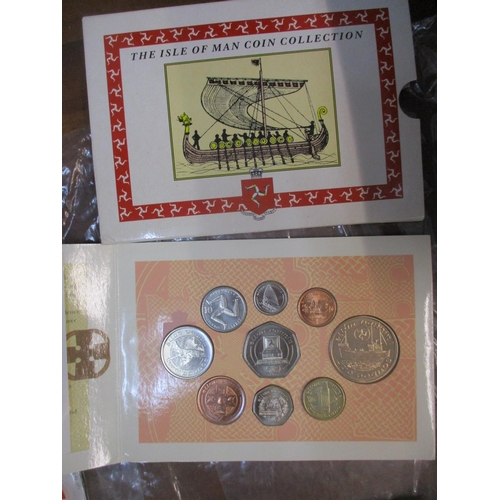 80 - A quantity of British coinage to include framed and glazed sets including a Royal Buckingham collect... 