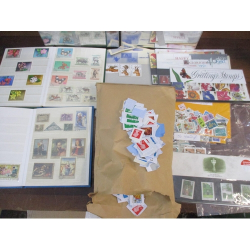 81 - A quantity of stamps to include two tins of mainly Belgium loose stamps, two albums of Magyar and Ea... 