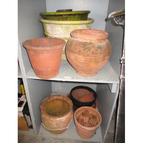 89 - A mixed lot to include various terracotta garden planters and pot, one in a green glaze, a 19th cent... 