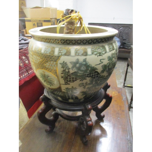 92 - A contemporary Chinese porcelain goldfish bowl planter decorated with five carp and river foliage to... 