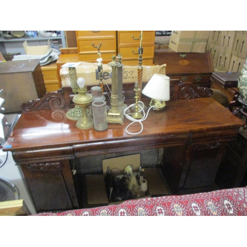 233 - A Regency mahogany twin pedestal serving table, extended back with leaf and scrolled decoration, the... 