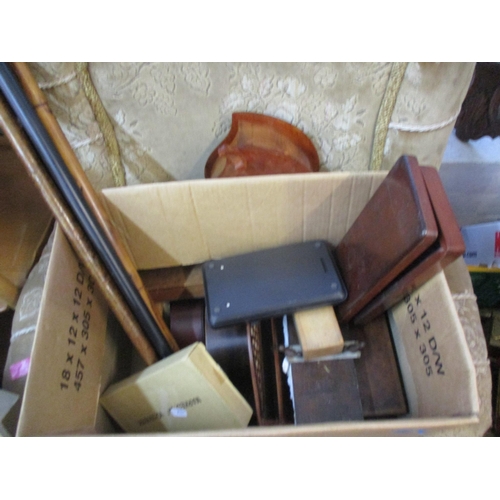 37 - A mixed lot to include walking sticks, mantel clocks, letter rack, cameras to include a Canon A1200,... 