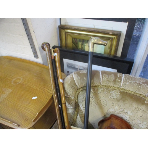 37 - A mixed lot to include walking sticks, mantel clocks, letter rack, cameras to include a Canon A1200,... 