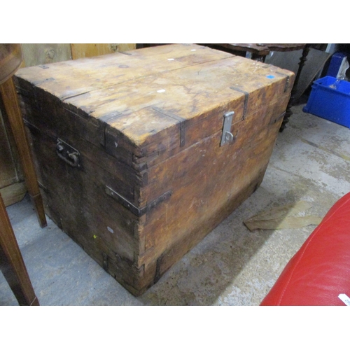 87 - A vintage wooden pine trunk with iron strapwork and carrying handles, and an early 20th century maho... 