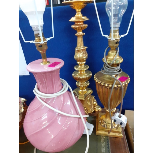 205 - A group of three table lamps to include two gold painted lamps and 3 cream pleated shades together w... 