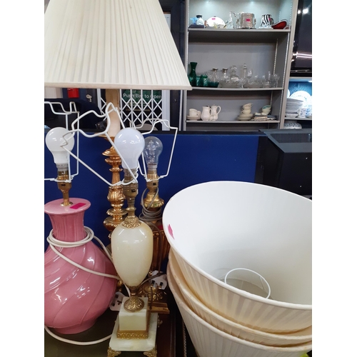 205 - A group of three table lamps to include two gold painted lamps and 3 cream pleated shades together w... 