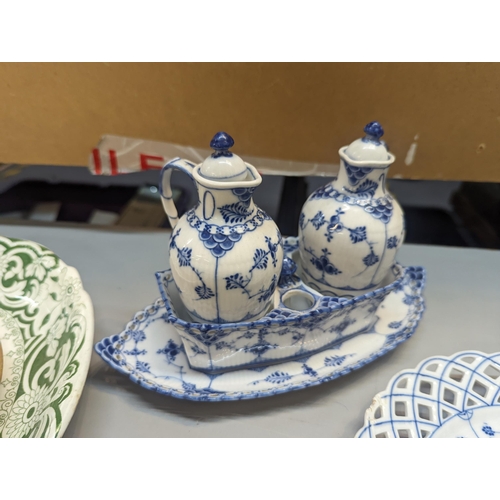 17 - A mixed lot of blue and white ceramics to include a Portuguese wall hanging candlestick, Royal Copen... 