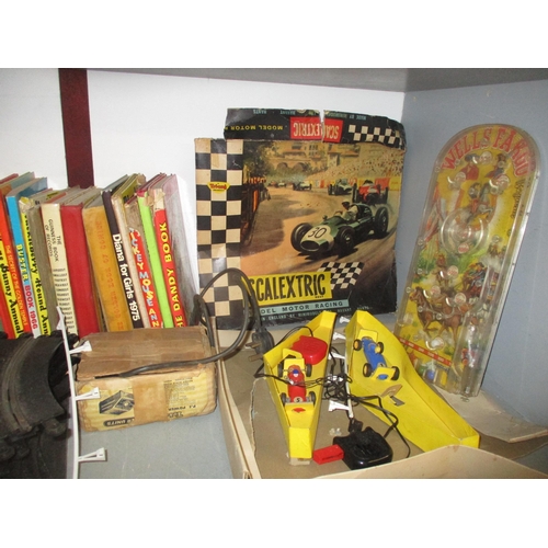 249 - A mixed lot of toys and children's annuals and books to include a Scalextric set, a boxed Barnsbury ... 