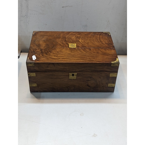 434 - A 19th century walnut writing box having brass mounts, with gilt embossed leather scriber A/F Locati... 