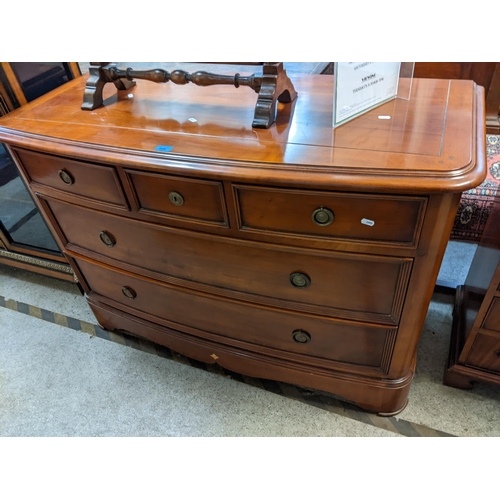 448 - A reproduction Brigitte Forestier French cherrywood bow front cabinet having three short and two lon... 