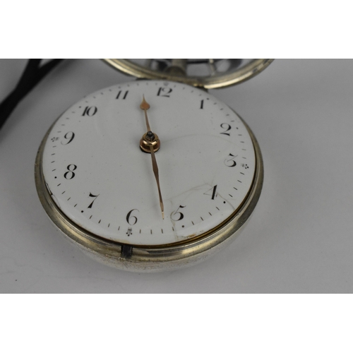 109 - A George III silver pair cased pocket watch having a white enamel dial A/F, with gilt hands and Arab... 