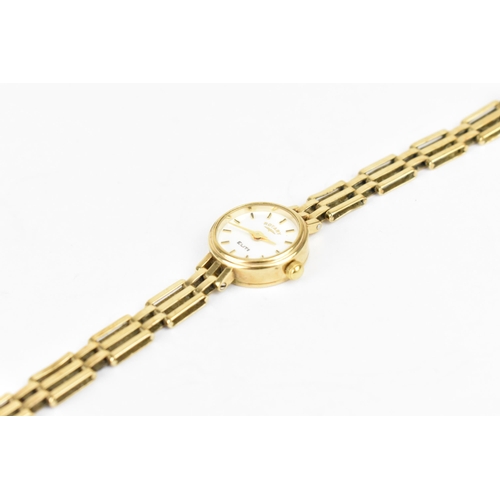 112 - A Rotary Elite quartz, ladies 9ct gold wristwatch having a white dial with baton markers, 9ct gold b... 