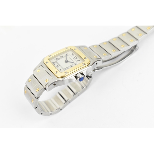 15 - A Cartier, Santos, ladies/unisex bi-metal wristwatch, having a signed white enamel dial with Roman n... 