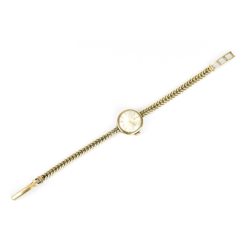 175 - A Tissot manual wind, ladies 9ct gold wristwatch having a silvered dial with baton markers, 9ct gold... 