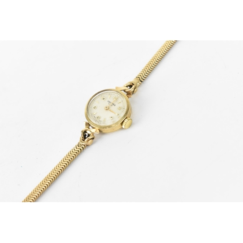 2 - A Vertex manual wind, ladies 9ct gold wristwatch having a white dial with Arabic numerals, 9ct gold ... 