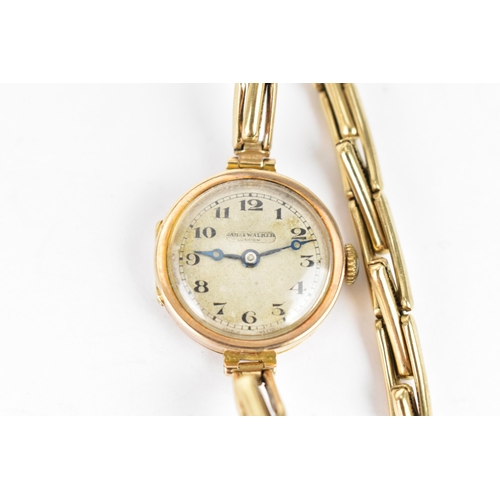 20 - An early 20th century ladies 9ct gold cased manual wind wristwatch having a silvered dial signed Jam... 