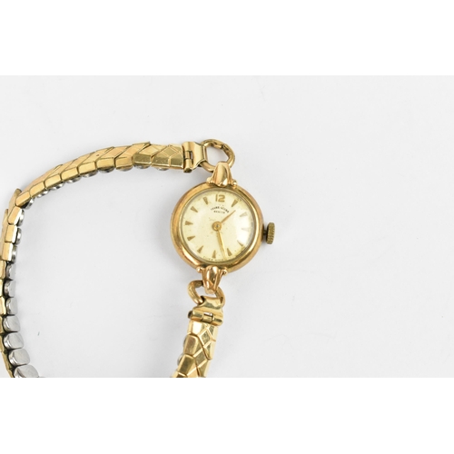 23 - A Favre Leuba, manual wind, ladies 9ct gold wristwatch having a white enamel dial with baton markers... 