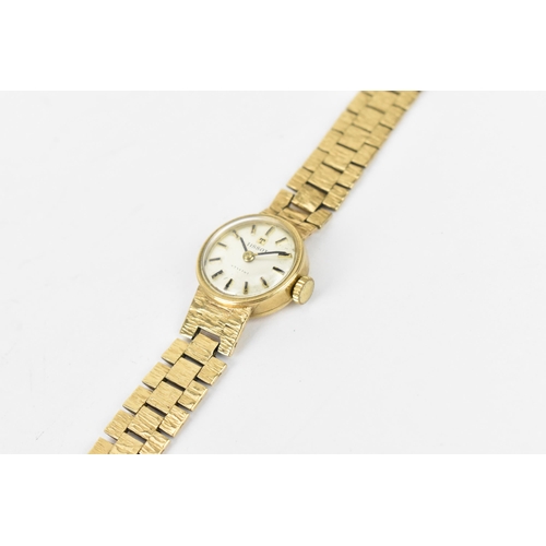 25 - A Tissot manual wind, ladies 9ct gold wristwatch having a silvered dial with baton markers, 9ct gold... 