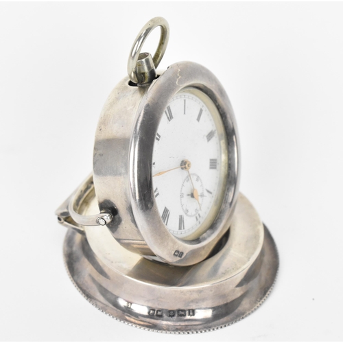 28 - An early 20th century open faced pocket watch having a white enamel dial, with gilt hands, Roman num... 