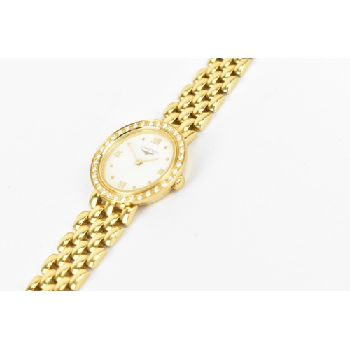 29 - A Longines, quartz, ladies 18ct gold wristwatch having a diamond set bezel, white enamel dial with R... 