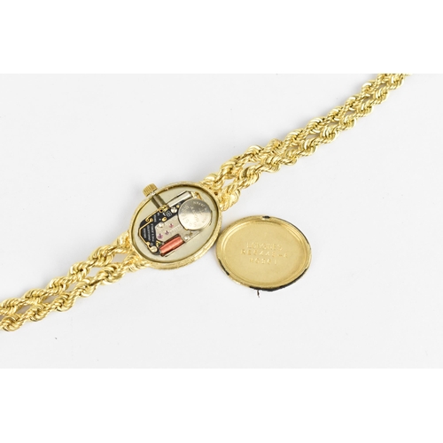 30 - A Longines quartz, ladies 14ct gold wristwatch having a diamond bezel, gilt dial with baton markers,... 