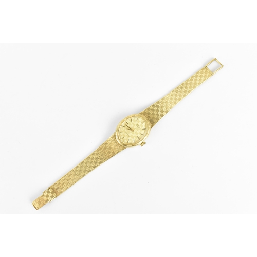 31 - A Rotary manual wind, ladies 9ct gold wristwatch having a gilt dial with baton markers and integral ... 