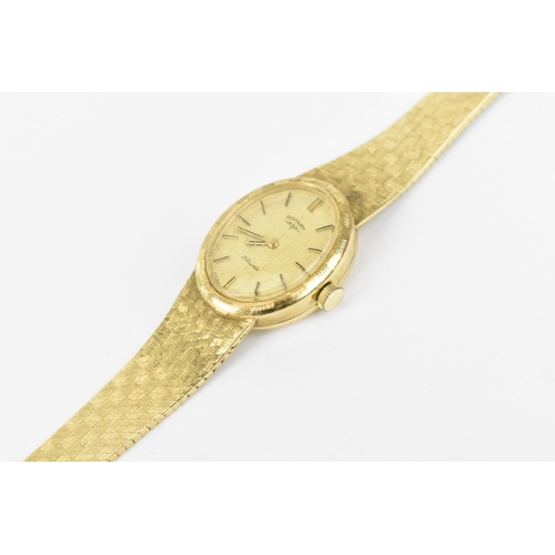 31 - A Rotary manual wind, ladies 9ct gold wristwatch having a gilt dial with baton markers and integral ... 