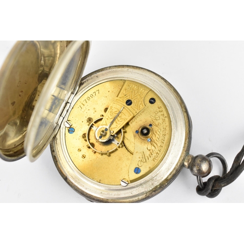 37 - A late 19th century Waltham silver cased open faced pocket watch having a white enamel dial, with gi... 