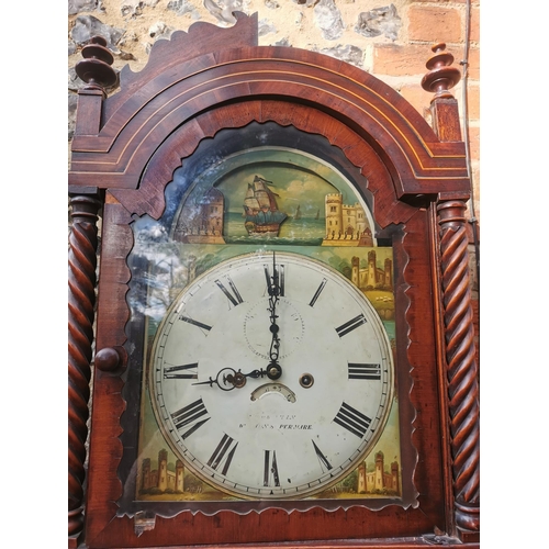 38 - A George III mahogany longcase clock having an arched top with turned finials, twin columns flanking... 