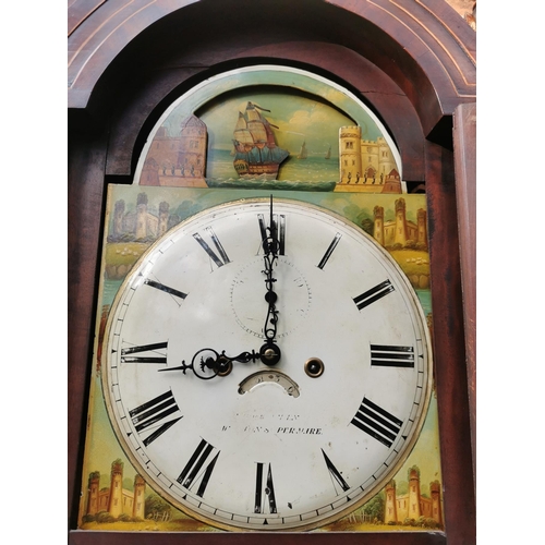 38 - A George III mahogany longcase clock having an arched top with turned finials, twin columns flanking... 