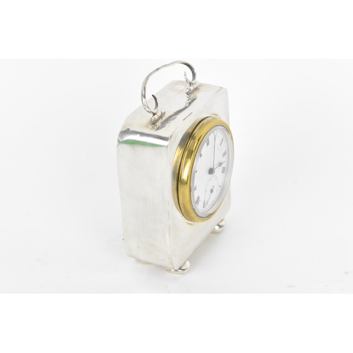 40 - An early 20th century miniature silver cased carriage clock, the case having scroll handle with turn... 