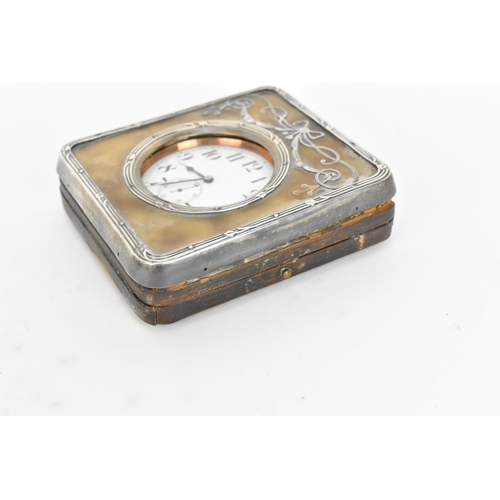 42 - An early 20th century Goliath nickel plated 8 day clock in a fitted silver and leather case, the wat... 