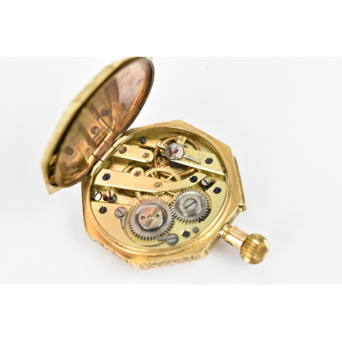 45 - A late 19th/early 20th century 14ct gold, open faced fob watch of octagonal form, having a white ena... 