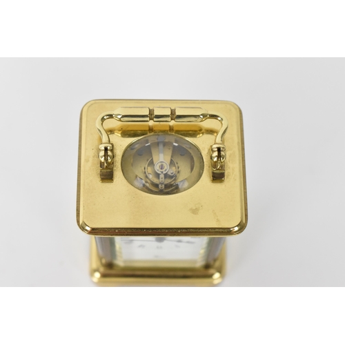 53 - A modern L'Epee brass cased miniature carriage clock, white enamel dial with Roman numerals, the mov... 