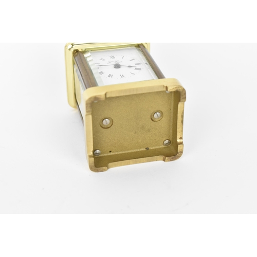 53 - A modern L'Epee brass cased miniature carriage clock, white enamel dial with Roman numerals, the mov... 