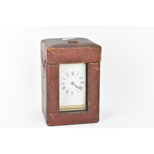 59 - An early 20th century brass cased repeater carriage clock having a white enamel dial with Roman nume... 