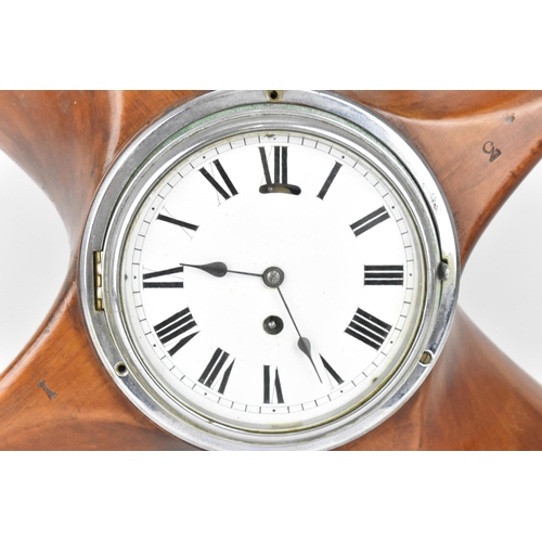 85 - An early 20th century clock set in a propeller hub, the 6.5 inch dial having Roman numerals with a c... 