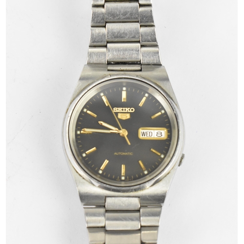 A Seiko 5 automatic, gents stainless steel wristwatch, having a black ...