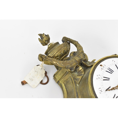 97 - A 19th century French gilt metal Louis XV style wall hanging clock, the case having a torch finial a... 