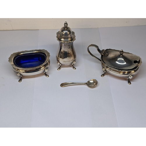 24 - A silver three piece condiments set and two spoons, 184g, with blue plastic liners
Location: 8.1