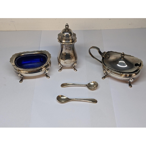 24 - A silver three piece condiments set and two spoons, 184g, with blue plastic liners
Location: 8.1