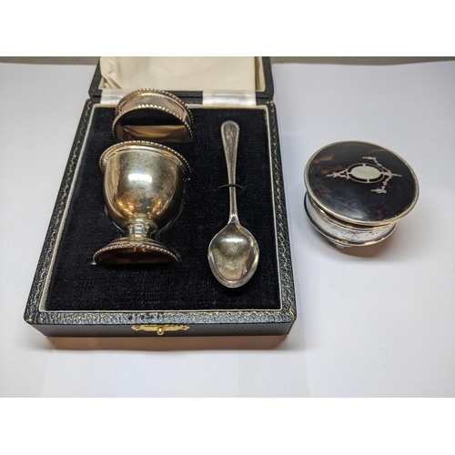 25 - A late 20th century silver three piece Christening set comprising an egg cup, a napkin ring and a sp... 