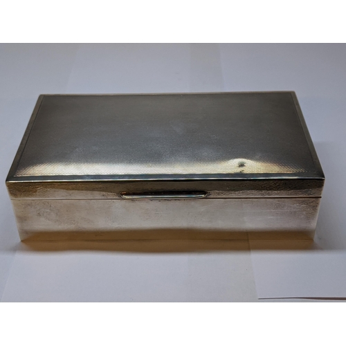 26 - A late 20th century silver cigarette box with engine turned decoration, 15.5cm w
Location: 6.1